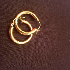 Gold medium sized hoop earrings.
